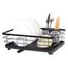 A black dish rack with plates, glasses, and cutlery. Produktbild-Vorschau