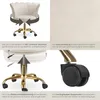 A collage of four images showcasing different features of a cream-colored office chair with a gold base and black wheels. Produktbild-Vorschau