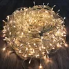 A tangled ball of warm white LED string lights on a wooden floor. Produktbild-Vorschau