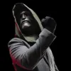 A person wearing a Doctor Doom mask and a hooded coat, with a fist raised. Anteprima dell’immagine prodotto