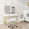 A white vanity desk with a lighted mirror and a white stool in a bedroom setting. Produktbild-Vorschau