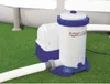 A pool filter pump is shown on artificial grass next to a pool. Voir les images du produit