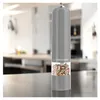 A modern electric pepper mill filled with peppercorns, placed on a kitchen countertop. Náhľad obrázku produktu