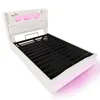 A white upholstered bed frame with integrated LED lighting. Náhľad obrázku produktu