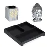 A Zen garden set with a Buddha head, a square tray with compartments, and a decorative holder with a Zen symbol. Náhled obrázku produktu
