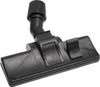 A close-up, studio shot of a black vacuum cleaner floor nozzle, isolated on a white background. Produktbild-Vorschau
