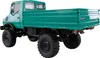 A green Mercedes-Benz Unimog truck with a flatbed, shown from a rear-side angle against a white background. Anteprima dell’immagine prodotto