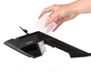 A hand pouring liquid from a clear measuring cup into a black garment steamer. Podgląd zdjęcia produktu