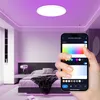 A bedroom with a smart ceiling light controlled by a smartphone app. Produktbild-Vorschau