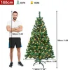 A man stands next to a Christmas tree, with measurements indicating the tree's height and width. Produktbild-Vorschau