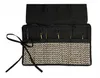 A black knitting needle case with a woven beige pattern and black ties. Produktbild-Vorschau