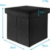 A black fabric storage ottoman with dimensions indicated by measurement lines and text. Náhled obrázku produktu