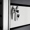 A close-up view of a stainless steel trash can enclosure with a chrome handle and two keys. Produktbild-Vorschau