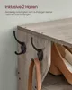 Close-up of a wooden shoe rack with hooks and a handbag strap hanging from one. Produktbild-Vorschau