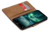 A book-style phone case with cards inserted, showing a smartphone screen. Náhľad obrázku produktu