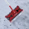 A red Swivel Sweeper G2 electric broom is shown on a textured gray surface. Produktbild-Vorschau
