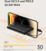 A black power bank is shown charging a smartphone, with text overlays highlighting its features and charging speed. Produktbild-Vorschau