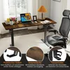 A home office setup with a height-adjustable desk, chair, and accessories. Voir les images du produit