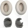 Two pairs of headphone ear pads and two foam inserts are laid out on a white background. Produktbild-Vorschau