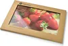 A product package with a window showing a cutting board with strawberries. Podgląd zdjęcia produktu