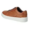 A side view of a brown leather sneaker with a white sole. Produktbild-Vorschau