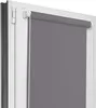 A close-up view of a gray roller blind installed on a white window frame. Produktbild-Vorschau