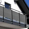 A balcony with a gray privacy screen. Produktbild-Vorschau