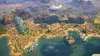 A sprawling city with a large body of water and mountainous terrain in the background, depicted in a video game. Produktbild-Vorschau