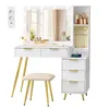 A white vanity table with gold legs and stool, featuring a lighted mirror and storage drawers, set against a white background. Produktbild-Vorschau