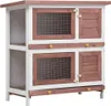 A two-tiered wooden rabbit hutch with four doors, set against a white background. Náhľad obrázku produktu