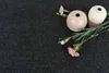 Two small vases and pink carnations on a dark gray textured background. Produktbild-Vorschau