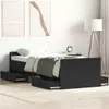A black bed frame with drawers is shown in a bedroom setting. Podgląd zdjęcia produktu