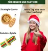 A young girl wearing a Santa hat gives a thumbs up next to images of strategy and patience games. Produktbild-Vorschau