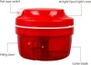 A red manual food chopper with labels pointing out its features. Produktbild-Vorschau