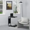 A modern living room scene with a side table, laptop, chair, and floor lamp. Náhľad obrázku produktu