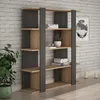A modern bookshelf with wooden shelves and dark gray vertical supports, set against a brick wall. Produktbild-Vorschau