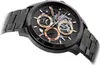 A close-up, angled shot of a black Tommy Hilfiger watch with rose gold accents. Náhľad obrázku produktu
