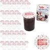 A set of empty jars with lids, a filled jar of jam, and a recipe booklet, all with a heart-themed design. Podgląd zdjęcia produktu