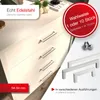 A close-up view of cabinet doors with handles, with promotional text overlays and product samples. Produktbild-Vorschau