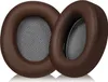 Two brown ear pads for headphones are shown against a white background. Podgląd zdjęcia produktu