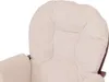 Close-up of a cream-colored corduroy cushion on a chair. Voir les images du produit