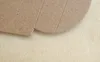 A close-up view of a brown cardboard material with some scored lines. Produktbild-Vorschau