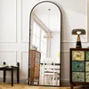 A full-length arched mirror is shown in a room with furniture. Anteprima dell’immagine prodotto