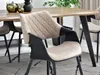 A dining chair in a modern dining room setting. Podgląd zdjęcia produktu