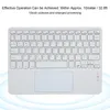 A white Bluetooth keyboard with a touchpad is shown from a top-down perspective against a white and light blue gradient background. Náhľad obrázku produktu