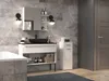 A modern bathroom vanity with a black sink, mirror, and storage shelves, next to a bathtub and a tall cabinet. A door is visible on the right. Náhľad obrázku produktu