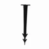 A black ground anchor or stake with a flat top and a pointed, double-pronged end, isolated on a white background. Podgląd zdjęcia produktu