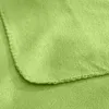 A close-up view of a light green fleece blanket, showing the texture and stitching of the hem. Produktbild-Vorschau