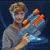 A young person holding a toy gun with a futuristic background. Podgląd zdjęcia produktu