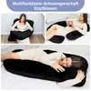 Collage of three images showing a pregnant woman using a black U-shaped pregnancy pillow in different positions: sitting and reading, lying on a bed reading, and sleeping. Produktbild-Vorschau